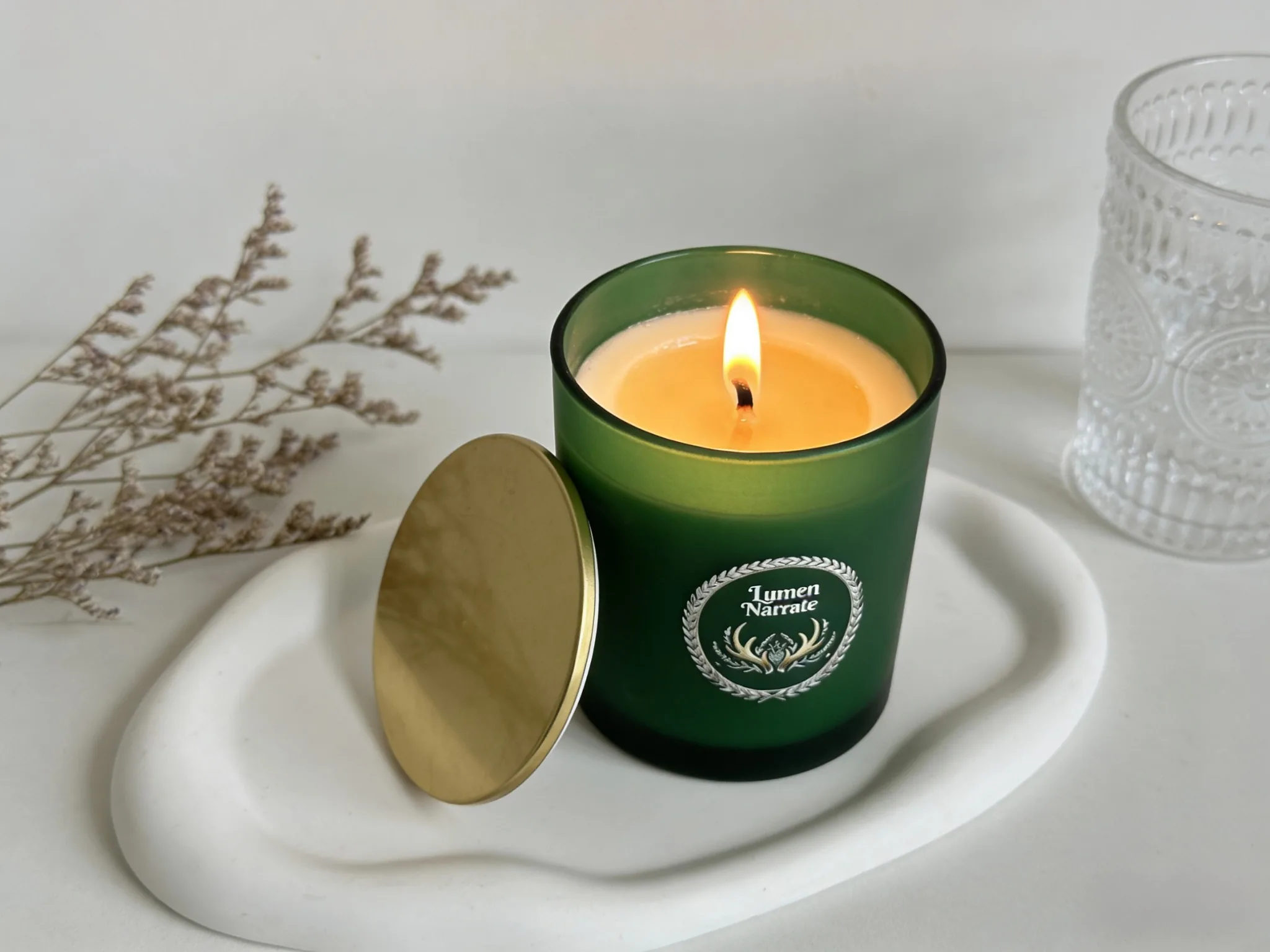 Matte green glass candle close-up